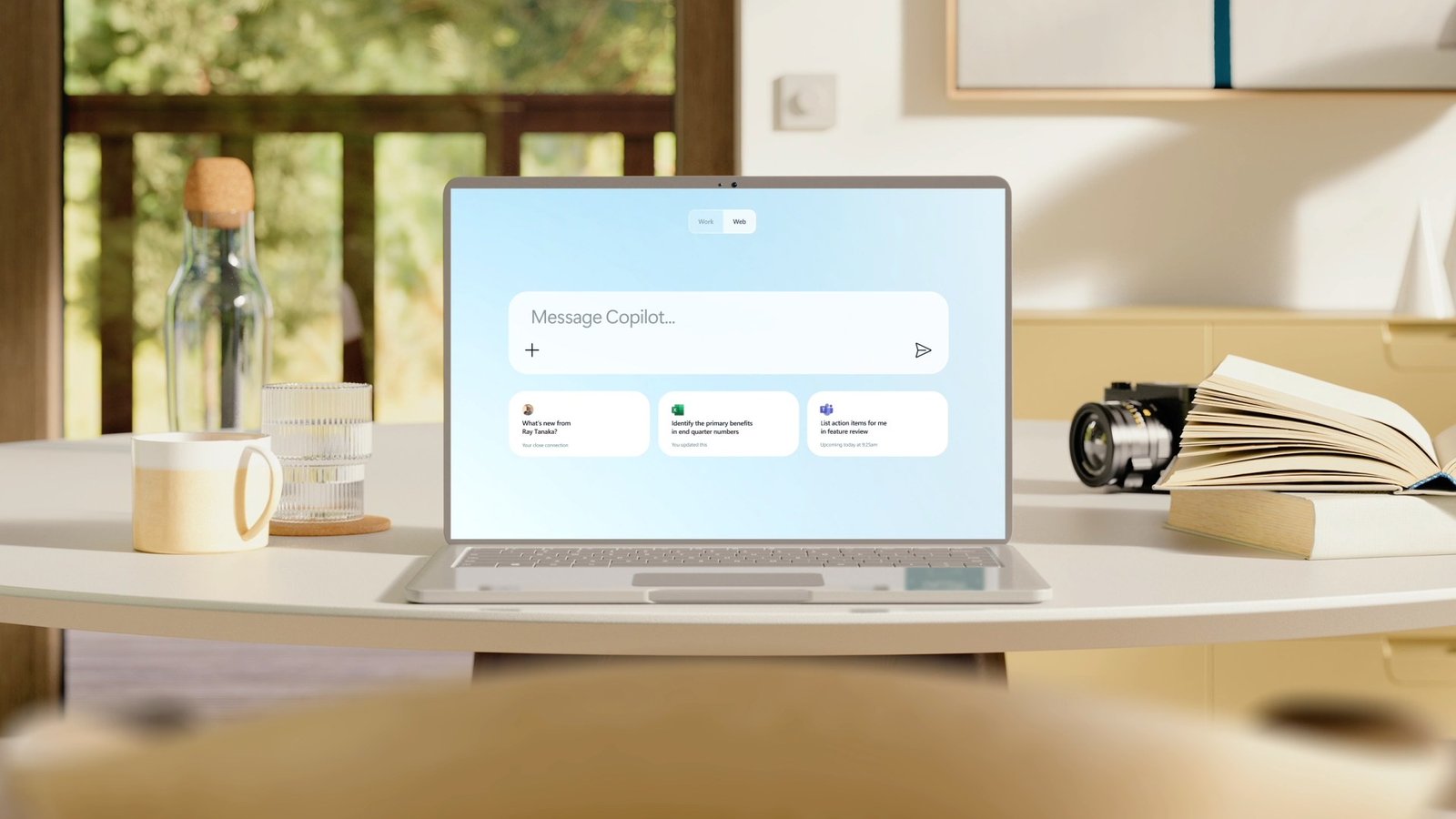 A laptop on a desk showing the Microsoft 365 Copilot prompt screen